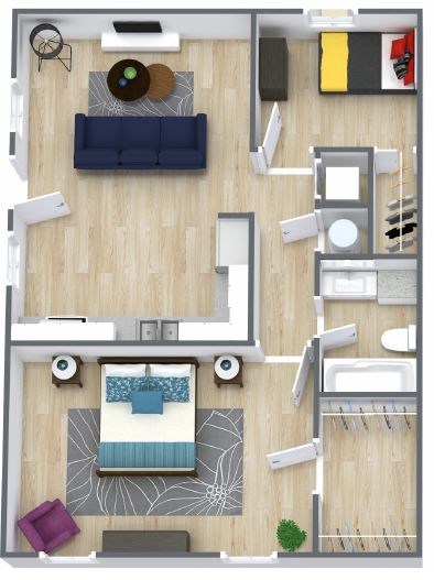 A top-down view of a living room with a blue couch, a coffee table, and a television.